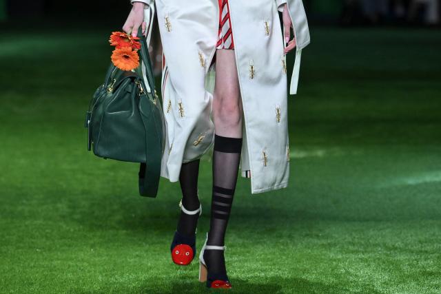 Shoe and bag details are seen on a model walking the runway during the 2027 Spring/Summer Thom Browne show as part of New York Fashion Week in New York on September 15, 2026. (Photo by ANGELA WEISS / AFP)