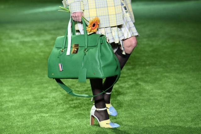 Shoe and bag details are seen on a model walking the runway during the 2027 Spring/Summer Thom Browne show as part of New York Fashion Week in New York on September 15, 2026. (Photo by ANGELA WEISS / AFP)