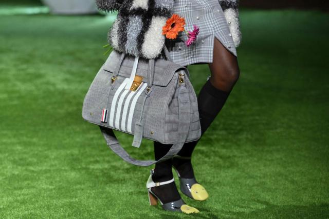Shoe and bag details are seen on a model walking the runway during the 2027 Spring/Summer Thom Browne show as part of New York Fashion Week in New York on September 15, 2026. (Photo by ANGELA WEISS / AFP)
