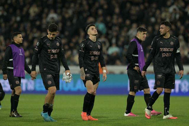 Platense players react at the end of the Copa Libertadores quarter-final second leg football match between Argentina's Platense and Brazil's Fluminense at the Ciudad de Vicente Lopez stadium in Vicente Lopez, Buenos Aires province, Argentina on September 15, 2026. (Photo by JUAN MABROMATA / AFP)