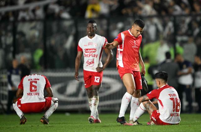Santa Fe players react after losing the Copa Sudamericana quarter-final second leg football match between Brazil's Vasco da Gama and Colombia's Independiente Santa Fe at the Sao Januario stadium in Rio de Janeiro, Brazil on September 15, 2026. (Photo by MAURO PIMENTEL / AFP)