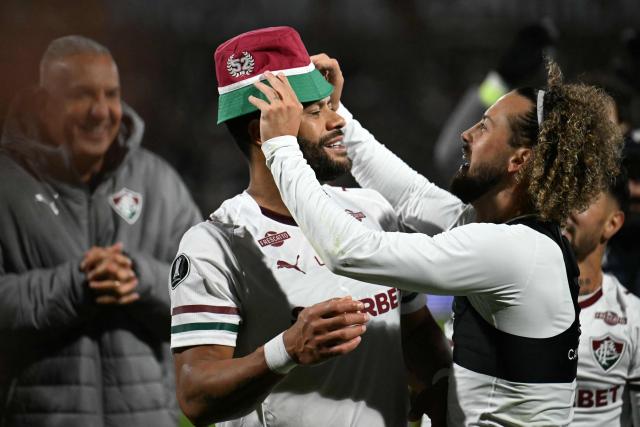 Fluminense's forward #07 Hulk (L) and defender #23 Guga celebrate advancing to the semifinals at the end of the Copa Libertadores quarter-final second leg football match between Argentina's Platense and Brazil's Fluminense at the Ciudad de Vicente Lopez stadium in Vicente Lopez, Buenos Aires province, Argentina on September 15, 2026. (Photo by Luis ROBAYO / AFP)