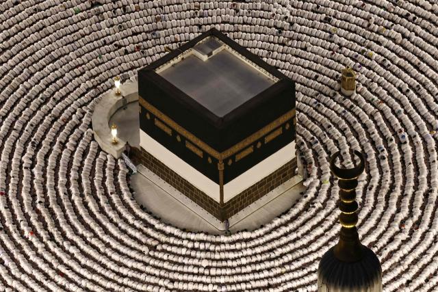 (FILES) This aerial view shows the Grand Mosque complex in Mecca, as Muslims perform the evening prayer around the Kaaba, Islam's holiest shrine, on May 24, 2026, ahead of the annual Hajj pilgrimage. The Saudi-led coalition battling Yemen's Houthis accused the rebels on September 16, 2026, of targeting Islam's holy city Mecca, sparking outrage across the Muslim world and deepening the conflict roiling the region. (Photo by Zain JAAFAR / AFP)