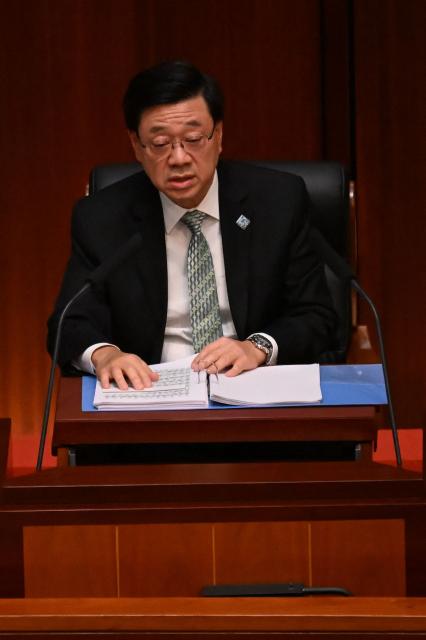 Hong Kong Chief Executive John Lee delivers Hong Kong's first five-year plan and his annual policy address at Central Government Offices chamber on September 16, 2026. (Photo by Peter PARKS / AFP)