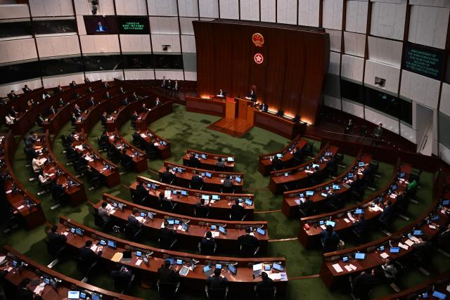 Hong Kong Chief Executive John Lee delivers Hong Kong's first five-year plan and his annual policy address at Central Government Offices chamber on September 16, 2026. (Photo by Peter PARKS / AFP)