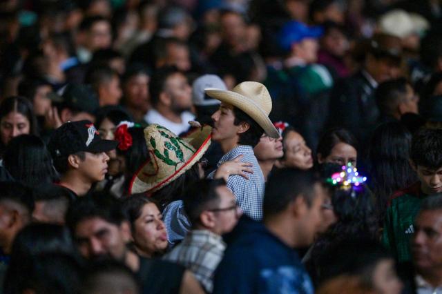 People gather at the Zocalo square to celebrate the traditional "Grito de Independencia" in Mexico City on September 15, 2026. (Photo by FRANYELI GARCIA / AFP)