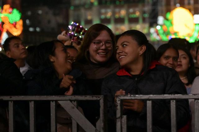 People gather at the Zocalo square to celebrate the traditional "Grito de Independencia" in Mexico City on September 15, 2026. (Photo by FRANYELI GARCIA / AFP)