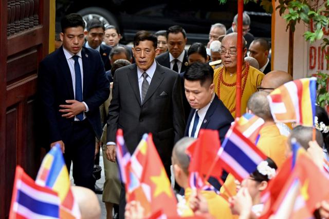 Thailand's King Maha Vajiralongkorn (C) arrives to attend a prayer ceremony for peace and well-being at Quan Su Pagoda in Hanoi on September 16, 2026. (Photo by Nhac NGUYEN / AFP)
