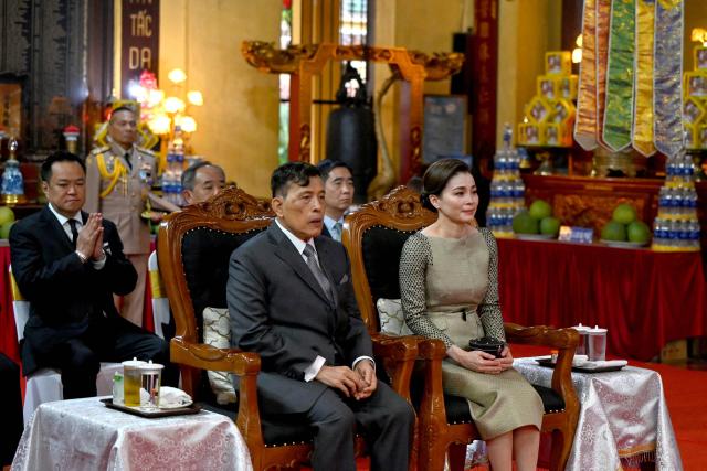 Thailand's King Maha Vajiralongkorn (L) and Queen Suthida attend a prayer ceremony for peace and well-being at Quan Su Pagoda in Hanoi on September 16, 2026. (Photo by Nhac NGUYEN / AFP)