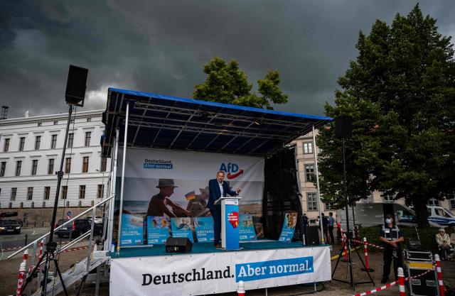 (FILES) Alternative for Germany (AfD) party state chairman in Mecklenburg-Western Pomerania Leif-Erik Holm addresses supporters during a rally to launch their electoral campaign ahead of the September 26, 2021 federal elections, in Schwerin, northern Germany, on August 10, 2021. Germany's anti-immigration AfD is eyeing another election triumph on September 20, 2026 in the northeastern coastal state of Mecklenburg-Western Pomerania, where the popular premier Manuela Schwesig is campaigning on the promise she can hold back a rising far-right tide. Schwesig of the centre-left SPD -- a cancer survivor with high personal approval ratings and a large social media following -- is fighting a battle watched closely across Germany. Leif-Erik Holm, 56, is not known for the radical edge or charisma of some other AfD figures but has every chance of cruising to victory on the party's current momentum. (Photo by John MACDOUGALL / AFP)