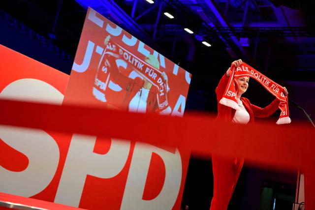 (FILES) Mecklenburg-Vorpommern's State Premier Manuela Schwesig displays a scarf with a slogan as she addresses delegates during a congress of Germany's Social Democratic Party (SPD) in Berlin on January 11, 2025. Germany's anti-immigration AfD is eyeing another election triumph on September 20, 2026 in the northeastern coastal state of Mecklenburg-Western Pomerania, where the popular premier Manuela Schwesig is campaigning on the promise she can hold back a rising far-right tide. Schwesig of the centre-left SPD -- a cancer survivor with high personal approval ratings and a large social media following -- is fighting a battle watched closely across Germany. The AfD's candidate for State Premier Leif-Erik Holm, 56, is not known for the radical edge or charisma of some other AfD figures but has every chance of cruising to victory on the party's current momentum. (Photo by John MACDOUGALL / AFP)
