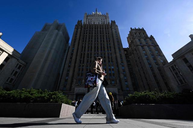 A woman walks past the Russian Foreign Ministry headquarters in central Moscow on September 16, 2026. (Photo by Igor IVANKO / AFP)
