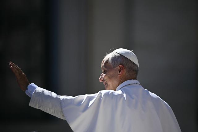Pope Leo XIV waves to pilgrims as he leaves after his weekly general audience at The Vatican on September 16, 2026. (Photo by Filippo MONTEFORTE / AFP)