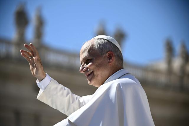 Pope Leo XIV waves to pilgrims as he leaves after his weekly general audience at The Vatican on September 16, 2026. (Photo by Filippo MONTEFORTE / AFP)