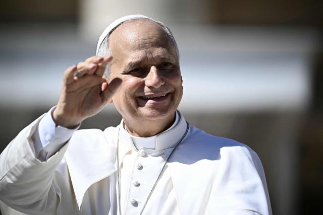 Pope Leo XIV waves to pilgrims as he leaves after his weekly general audience at The Vatican on September 16, 2026. (Photo by Filippo MONTEFORTE / AFP)