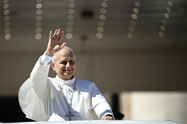 Pope Leo XIV waves to pilgrims as he leaves after his weekly general audience at The Vatican on September 16, 2026. (Photo by Filippo MONTEFORTE / AFP)