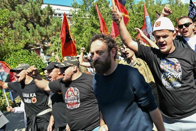 Kosovo Albanians gather during a rally in Pristina on September 16, 2026 on the day of the war crimes verdict in the trial held in The Hague of former Kosovo President Hashim Thaci and three senior ex-guerrilla leaders. Kosovo's former president Hashim Thaci was sentenced to 25 years by a tribunal in The Hague on Wednesday for war crimes, the court said in a long-awaited verdict likely to spark outrage in the Balkan country. The judges said Thaci, who was tried along with three other former guerrilla leaders, was guilty of illegal arrests, torture, murder and cruel treatment committed by guerrilla fighters. (Photo by Elvis BARUKCIC / AFP)