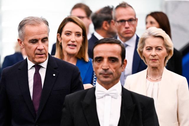 (From L) Canada's Prime Minister Mark Carney, EU Parliament President Roberta Metsola and European Commission President Ursula von der Leyen arrive for a speech during European Commission President's annual State of the Union address at a plenary session of the European Parliament in Strasbourg, eastern France on September 16, 2026. EU chief Ursula von der Leyen said on September 16, 2026 the future of the 27-nation bloc depends on how it manages climate change and artificial intelligence, as she delivered a major speech in Strasbourg. (Photo by Jean-Christophe VERHAEGEN / AFP)