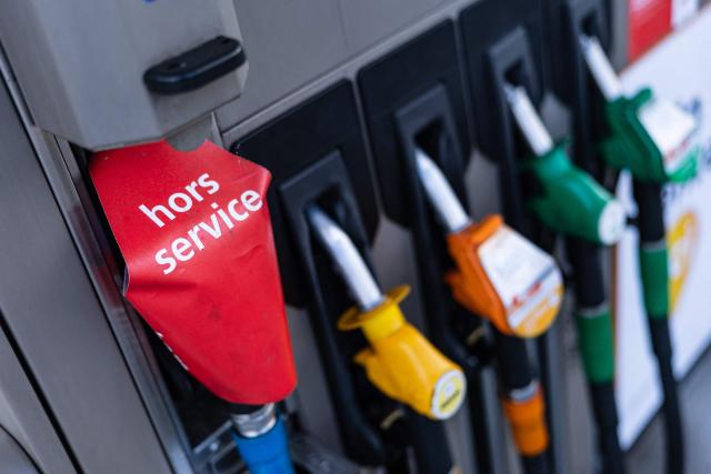 This photograph shows a fuel pump marked “hors service” (out of service) at a TotalEnergies petrol station following vandalism in Pecquencourt, northern France, on September 16, 2026. Energy prices jumping by 16%, while fresh produce such as tomatoes, courgettes and lettuce soar by 20%: behind an overall annual inflation rate of 2.4% in France in August, lie some spectacular price increases that are hitting lower-income households hardest. (Photo by Sameer Al-DOUMY / AFP)