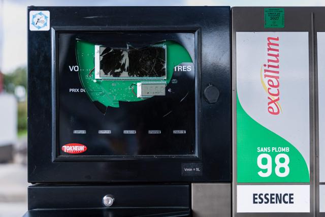 This photograph shows a damaged payment screen at a TotalEnergies petrol station following vandalism in Pecquencourt, northern France, on September 16, 2026. Energy prices jumping by 16%, while fresh produce such as tomatoes, courgettes and lettuce soar by 20%: behind an overall annual inflation rate of 2.4% in France in August, lie some spectacular price increases that are hitting lower-income households hardest. (Photo by Sameer Al-DOUMY / AFP)