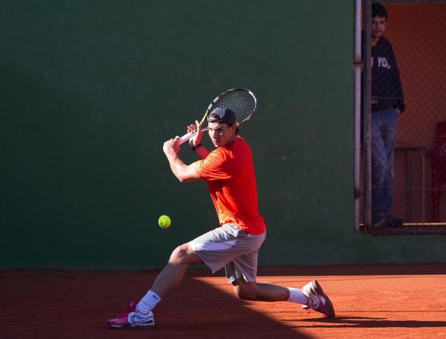 (FILES) Spanish tennis player Rafael Nadal takes part in a training session in Manacor on the Spanish Balearic Island of Mallorca on January 30, 2013. Retired Spanish tennis player Rafael Nadal will return to the court in front of a crowd for the first time since retirement in October to celebrate his academy's 10th anniversary, AFP reports on September 16, 2026. (Photo by Jaime REINA / AFP)