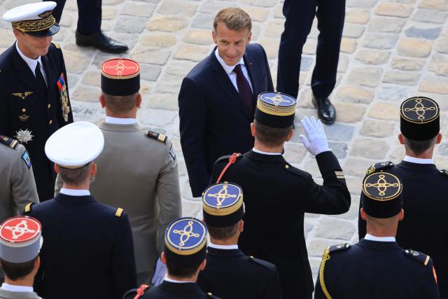 France's President Emmanuel Macron (top c) meets with members of the armed forces during an armed forces decoration ceremony at the Hôtel National des Invalides in Paris on September 16, 2026. (Photo by Ludovic MARIN / AFP)