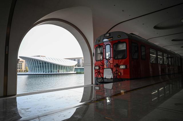 A shuttle train pulls into a stop at the Huawei Lianqiu Lake research campus during a media tour in Shanghai on September 16, 2026. (Photo by Jade GAO / AFP)