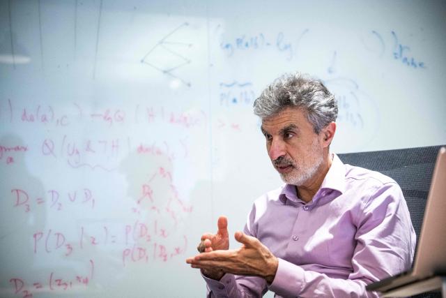 Canadian computer scientist Yoshua Bengio speaks during an interview with AFP in the offices of Law Zero in Montreal, Quebec, on September 15, 2026. Bengio, considered one of the founders of AI, told AFP that humanity is "losing control" of the technology and the world needs guardrails similar to nuclear arms controls. (Photo by ANDREJ IVANOV / AFP)