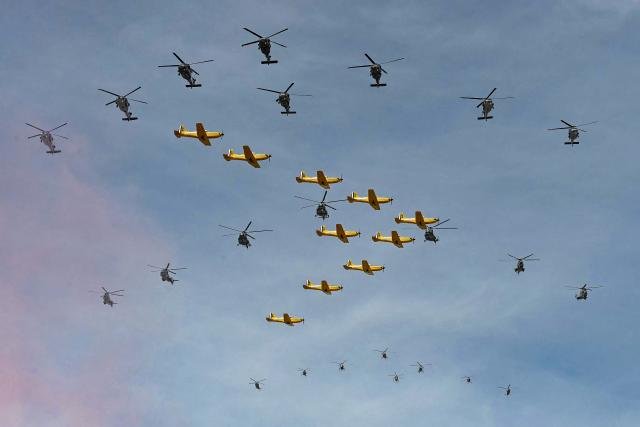 Mexican Air Force aircraft and helicopters perform a flypast over Mexico City's Zocalo square during the Independence Day military parade in Mexico City on September 16, 2026. (Photo by YURI CORTEZ / AFP)
