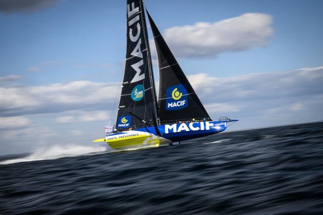 British skipper Sam Goodchild sails his Macif Imoca monohull to win the Run event of the Defi Azimut, a few weeks ahead of the Route du Rhum solo sailing race, off Lorient on September 16, 2026. (Photo by Loic VENANCE / AFP)