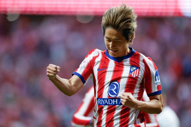 Atletico Madrid's South Korean midfielder #07 Kang-In Lee celebrates scoring his team's second goal during the Spanish league football match between Club Atletico de Madrid and CA Osasuna at the Metropolitano stadium in Madrid on September 16, 2026. (Photo by Oscar DEL POZO / AFP)