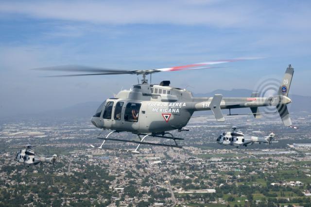 Helicopters of the Mexican Air Force perform a flypast over Mexico City during the Independence Day military parade in Mexico City on September 16, 2026. (Photo by Alfredo ESTRELLA / AFP)