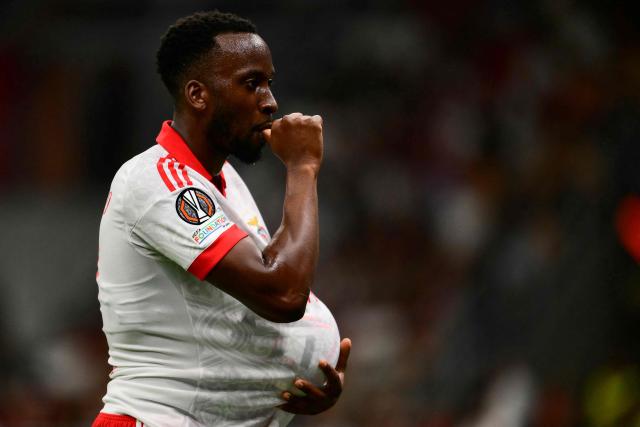 Benfica’s Belgian forward #11 Dodi Lukebakio celebrates after scoring his team's first goal during the UEFA Europa League 1st round day 1 football match between Ac Milan and Benfica at the San Siro Stadium in Milan on September 16, 2026. (Photo by Marco Bertorello / AFP)
