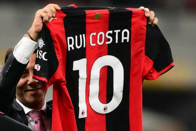 AC Milan former Portuguese player Manuel Rui Costa holds his jersey during the UEFA Europa League 1st round day 1 football match between Ac Milan and Benfica at the San Siro Stadium in Milan on September 16, 2026. (Photo by Marco Bertorello / AFP)