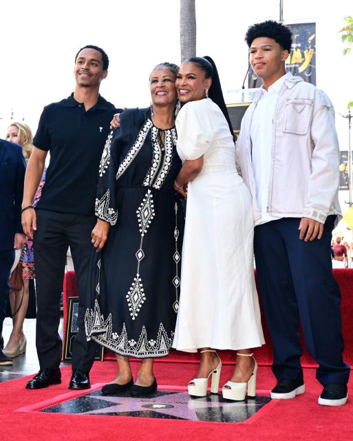 US actress Nia Long (C/R) poses with her mother Talita Long (C/L) and her children Massai Zhivago Dorsey II (L) and Kez Sunday Udoka during her Hollywood Walk of Fame star unveiling ceremony in the Hollywood neighborhood of Los Angeles on September 16, 2026. (Photo by Frederic J. BROWN / AFP)
