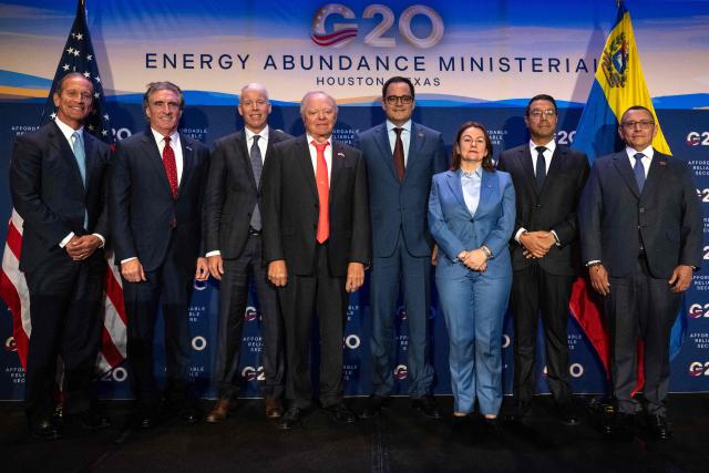 (L/R) CEO of Continental Resources Doug Lawler, US Secretary of the Interior Doug Burgum, US Secretary of Energy Chris Wright, Chairman of Continental Resources Harold Hamm, Venezuelan Vice President for Economy and Finance Calixto Ortega Sanchez, Venezuelan Hydrocarbons Minister Paula Henao, Venezuelan Mining Minister Hector Silva and Vice President of Venezuelas state-owned oil company PDVSA Jovanny Martinez pose for a picture during the third day of the G20 Ministerial Meeting on Energy Abundance in Houston, Texas on September 16, 2026. The discussions are slated to run through September 16 in Houston, in the oil-rich US state of Texas. The meetings gather delegations from the world's largest economies -- including China, India, Japan and Germany -- with major oil producers set to attend, such as Canada and Saudi Arabia. (Photo by RONALDO SCHEMIDT / AFP)