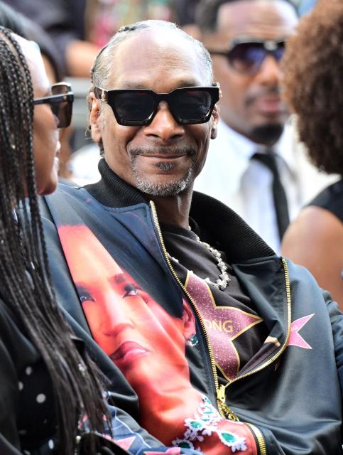 US rapper Snoop Dogg attends the Hollywood Walk of Fame star unveiling ceremony for US actress Nia Long in the Hollywood neighborhood of Los Angeles on September 16, 2026. (Photo by Frederic J. BROWN / AFP)