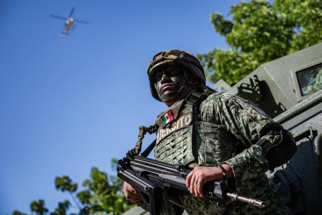 A Mexican soldier stands guard during the Independence Day military parade in Culiacan, state of Sinaloa, Mexico, on September 16, 2026. (Photo by Jesus Verdugo / AFP)