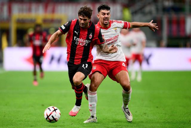 Ac Milan’s American midfielder #11 Christian Pulisic fights for the ball with Benfica’s Portuguese defender #44 Tomas Araujo during the UEFA Europa League 1st round day 1 football match between Ac Milan and Benfica at the San Siro Stadium in Milan on September 16, 2026. (Photo by Marco Bertorello / AFP)
