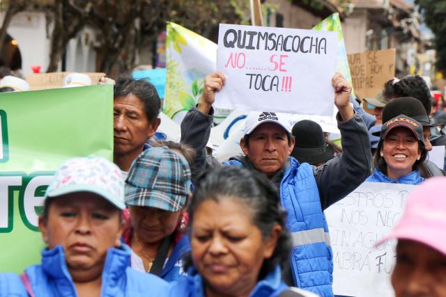 A demonstrator shows a sign in reference to Quimsacocha protected area during a march in defense of water resources and against mining projects in Cuenca, Ecuador on September 16, 2026. (Photo by Galo Paguay / AFP)