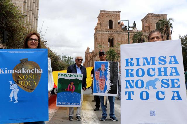 Demonstrator show signs in reference to Quimsacocha protected area during a march in defense of water resources and against mining projects in Cuenca, Ecuador on September 16, 2026. (Photo by Galo Paguay / AFP)