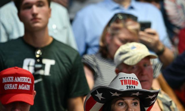 Supporters listen to US President Donald Trump speak at a rally at Gastonia Municipal Airport in Gastonia, North Carolina, on September 16, 2026. Trump is campaigning for Republican US Senate candidate Michael Whatley. (Photo by Brendan SMIALOWSKI / AFP)