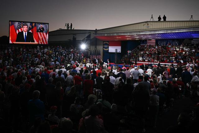 A video of Democrat and former governor of North Carolina Roy Cooper is seen on a screen as US President Donald Trump speaks at a rally at Gastonia Municipal Airport in Gastonia, North Carolina, on September 16, 2026. Trump is campaigning for Republican US Senate candidate Michael Whatley. (Photo by Brendan SMIALOWSKI / AFP)