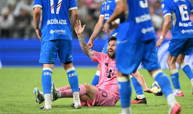 Inter Miami's Argentine forward #10 Lionel Messi raises his hand to signal a possible foul to the referee during the Campeones Cup final football match between Inter Miami CF and Mexico's Cruz Azul at Nu Stadium in Miami, Florida, on September 16, 2026. (Photo by CHANDAN KHANNA / AFP)