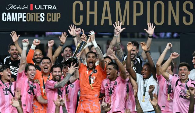 Inter Miami's Argentine forward #10 Lionel Messi holds up the trophy with teammates after his team defeated Mexico's Cruz Azul in the Campeones Cup final at Nu Stadium in Miami, Florida, on September 16, 2026. (Photo by CHANDAN KHANNA / AFP)