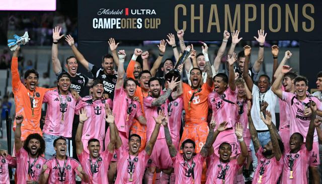 Inter Miami's Argentine forward #10 Lionel Messi holds up the trophy with teammates after his team defeated Mexico's Cruz Azul in the Campeones Cup final at Nu Stadium in Miami, Florida, on September 16, 2026. (Photo by CHANDAN KHANNA / AFP)