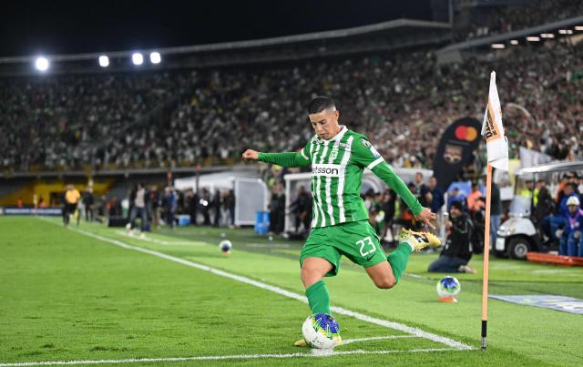 Atletico Nacional midfielder #23 James Rodriguez takes a corner kick during the Colombian first division football match between Internacional Bogota and Atletico Nacional at El Campin stadium in Bogota on September 16, 2026. James will play for a Colombian football side after 18 years overseas. (Photo by Raul ARBOLEDA / AFP)