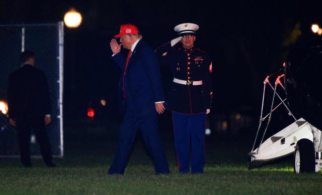 US President Donald Trump sakutes as he disembarks from Marine One after arriving on the Ellipse near the White House in Washington, DC on September 16, 2026. Trump is returning from Gastonia, North Carolina after campaigning for Republican US Senate candidate Michael Whatley. (Photo by Kent Nishimura / AFP)