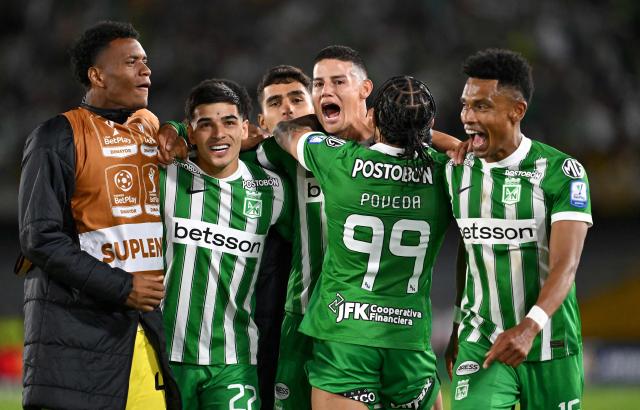 Atletico Nacional midfielder #23 James Rodriguez (C) celebrates his team's third goal during the Colombian first division football match between Internacional Bogota and Atletico Nacional at El Campin stadium in Bogota on September 16, 2026. James will play for a Colombian football side after 18 years overseas. (Photo by Raul ARBOLEDA / AFP)