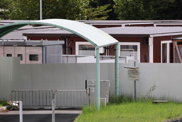 Temporary wooden container huts being used to house athletes for the 2026 Asian Games are seen at the Garden Pier in Nagoya on September 17, 2026. (Photo by DAVID GRAY / AFP)